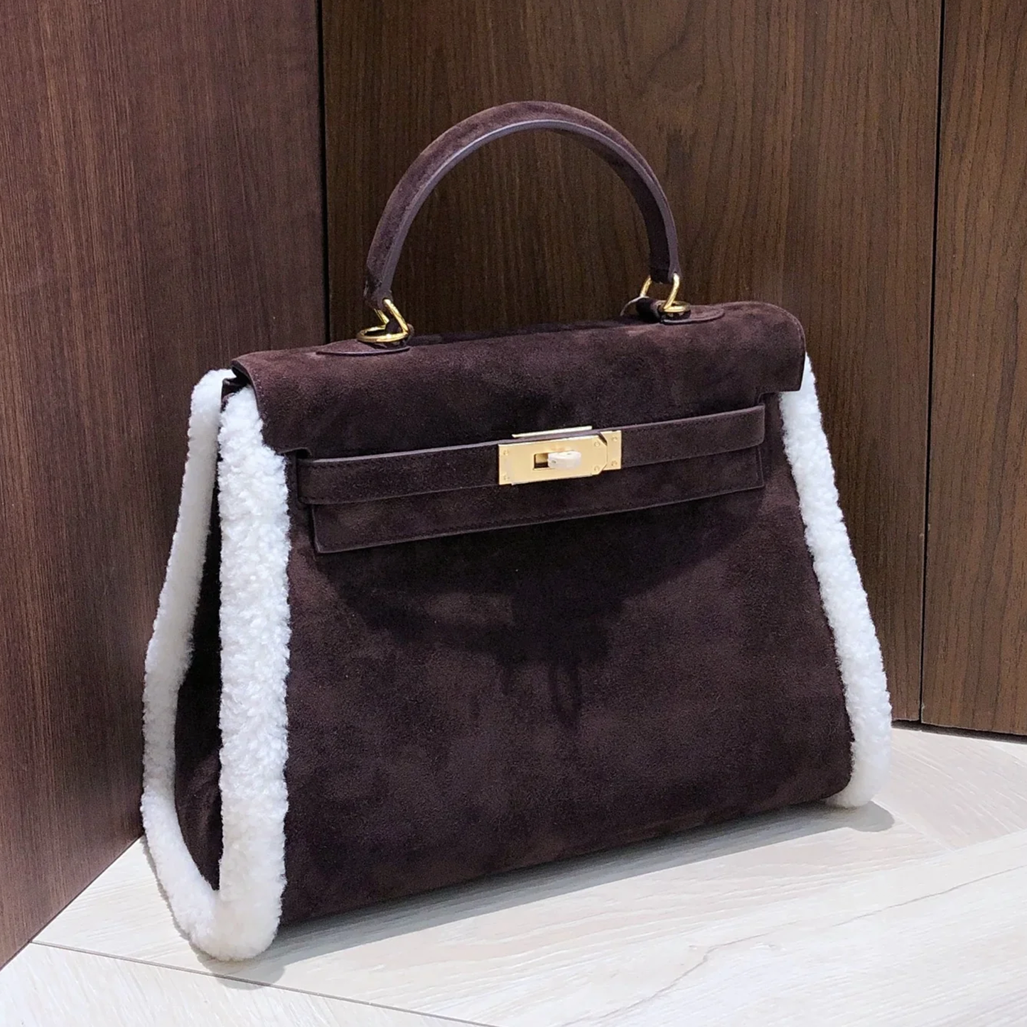 Deep Espresso Velvety Compact Trapezoid Hand Tote With Creamy White Curly Side Trim And Luminous Golden Twist Lock Hardware Fixtures