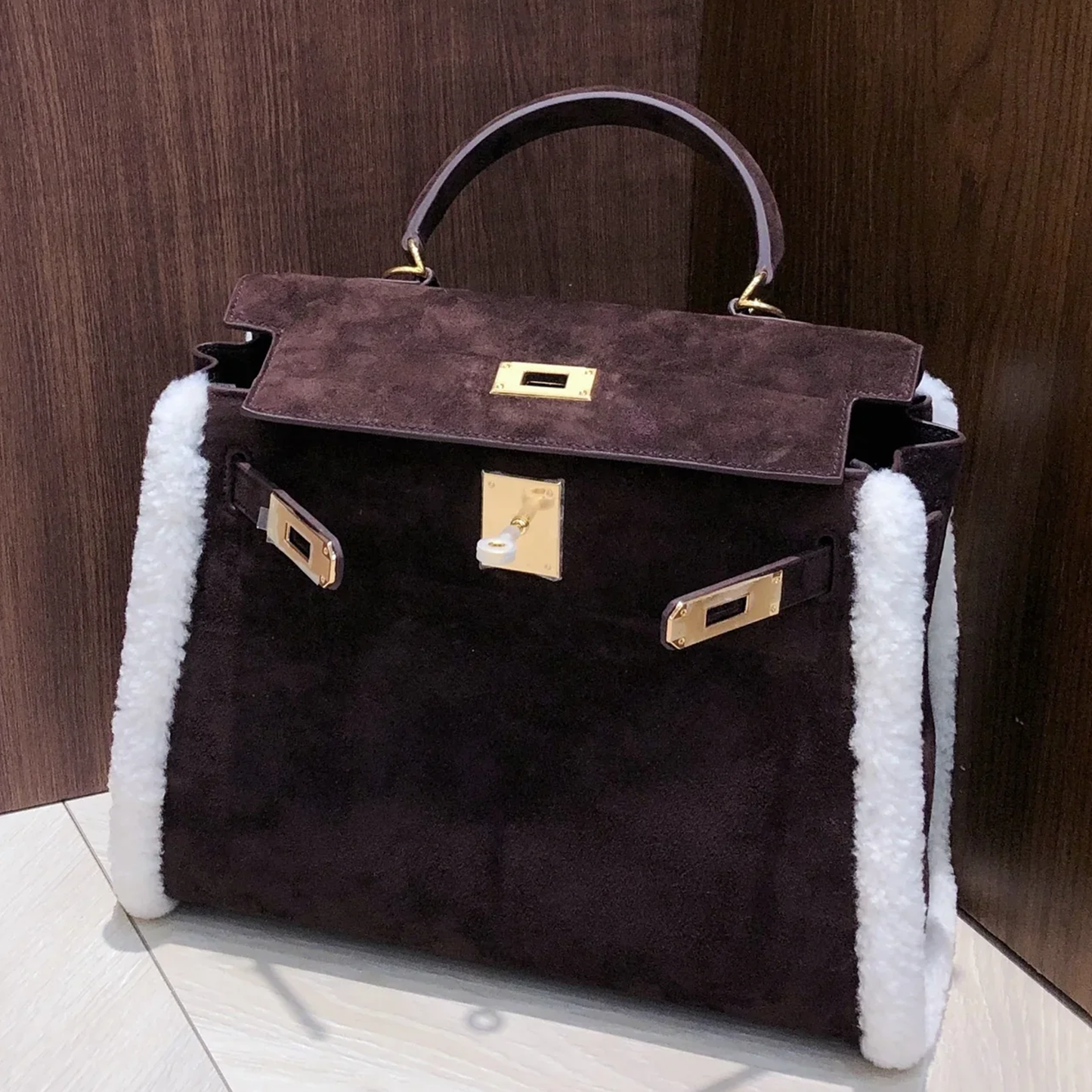 Deep Espresso Velvety Compact Trapezoid Hand Tote With Creamy White Curly Side Trim And Luminous Golden Twist Lock Hardware Fixtures